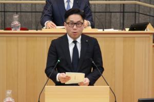 農林水産委員長の委員長報告の写真